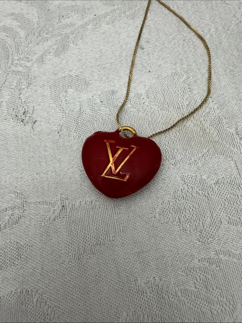 Louis Vuitton Gold-Tone Chain with Red Heart LV Pendant